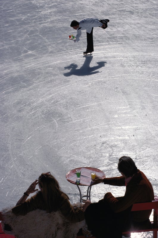 Skating Waiter (St. Moritz), 1963 by Slim Aarons