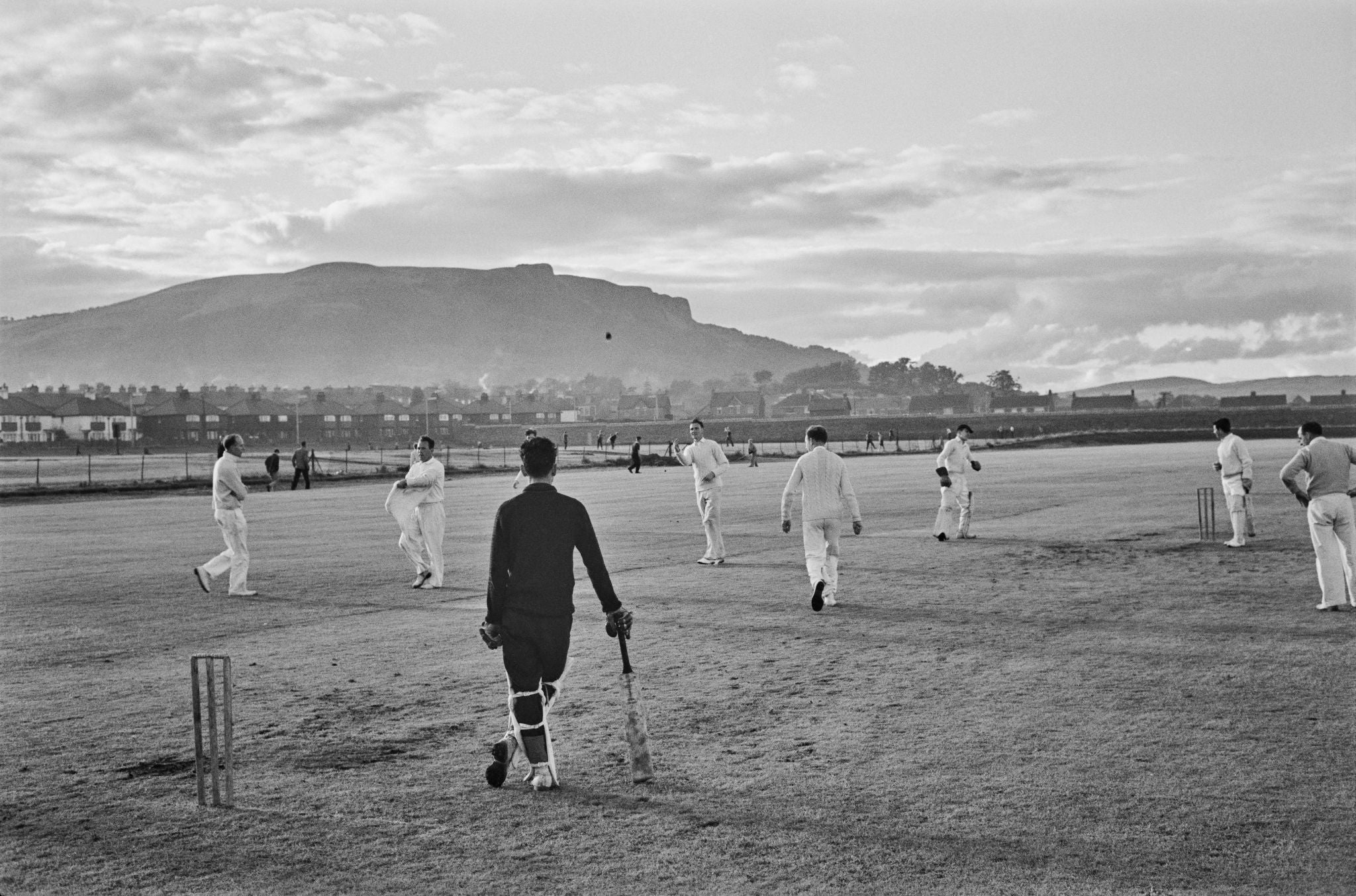 Cricketers on the Pitch (Belfast), 1962 by Slim Aarons