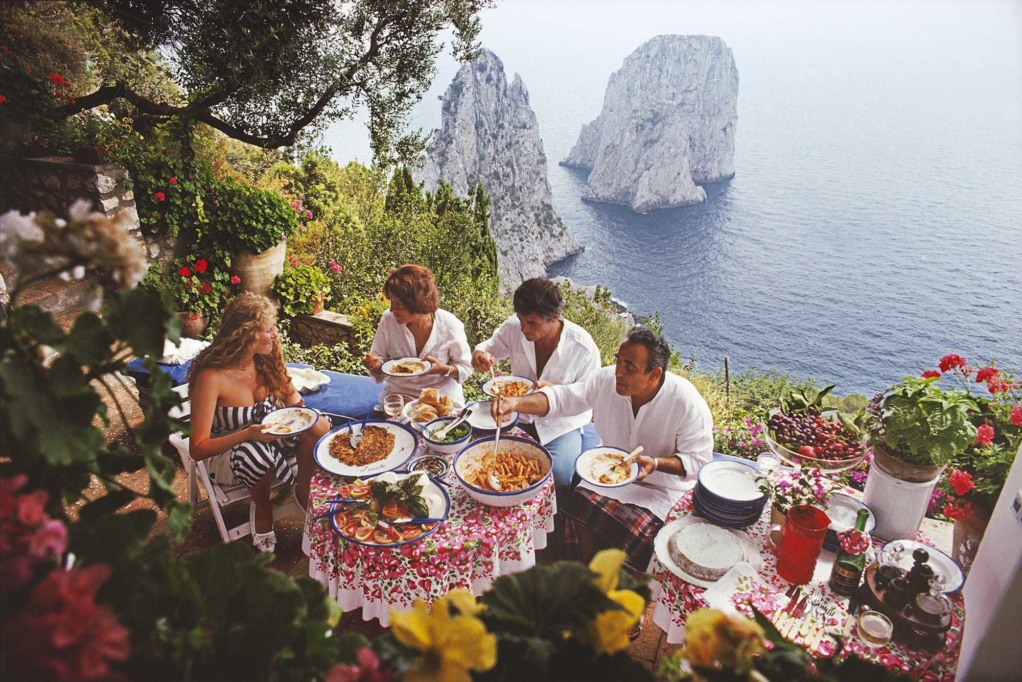 Dining Al Fresco On Capri, 1980 by Slim Aarons
