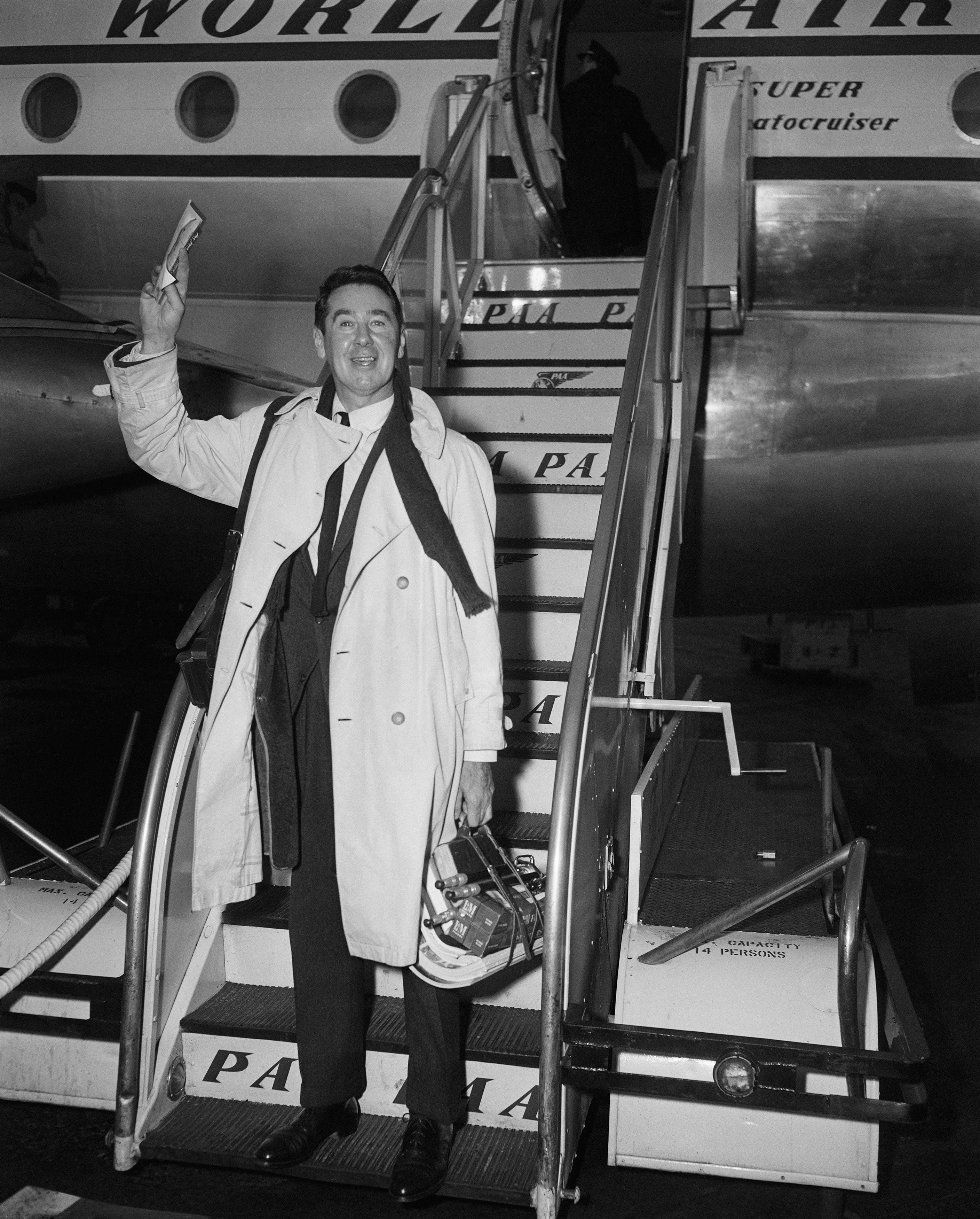 Slim Arrives (Pan Am Airlines), 1955 by Slim Aarons