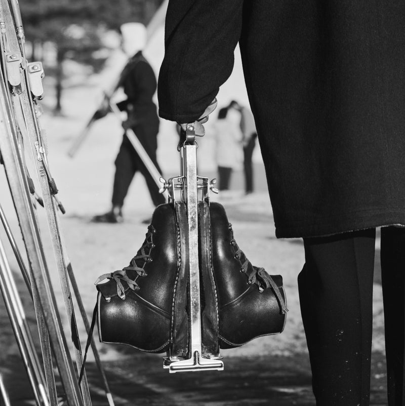 New England Skiing (Boots), 1955 by Slim Aarons