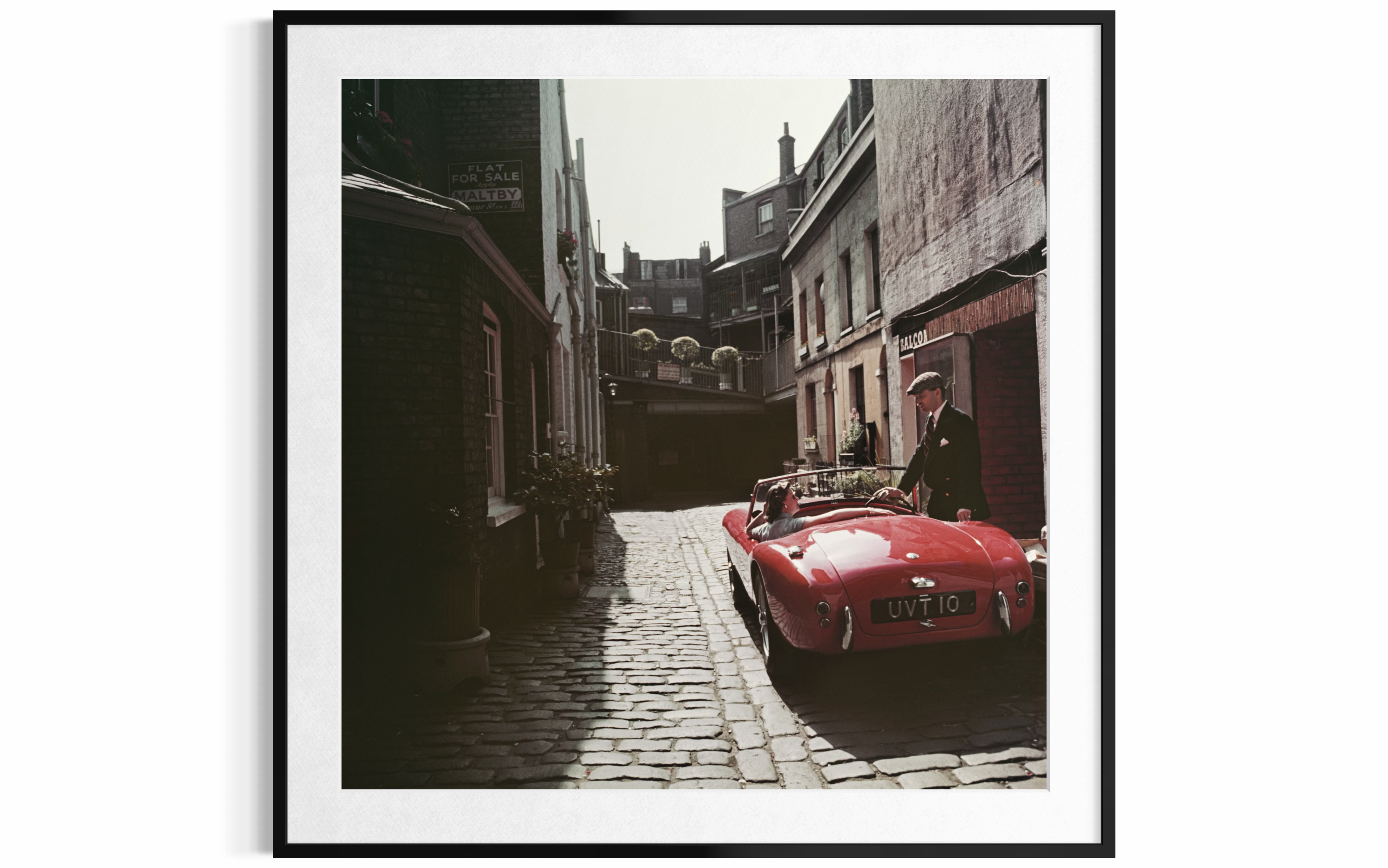 Sports Car Couple (London), 1955 by Slim Aarons